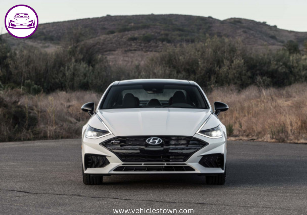 Side view of a sleek silver Hyundai Sonata parked under daylight. Modern midsize sedan showcasing bold design and aerodynamic curves.