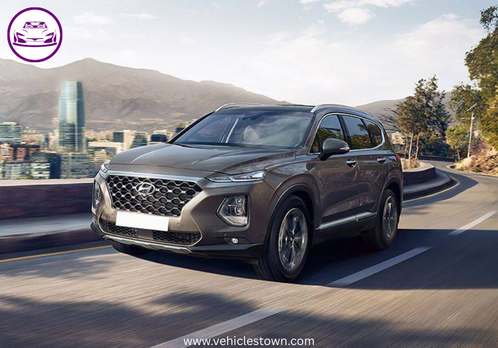 Side view of the Hyundai Santa Fe SUV parked outdoors, showcasing its sleek design. Modern headlights and bold grille highlight the Santa Fe’s dynamic exterior.