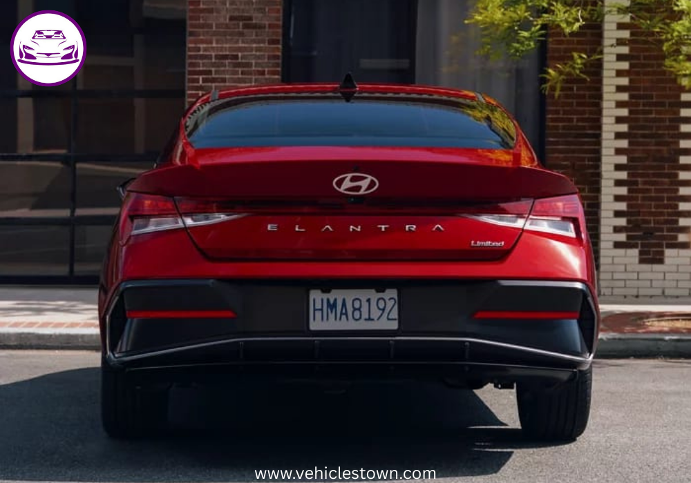 "Front view of the 2025 Hyundai Elantra Hybrid showcasing its sleek parametric grille and LED headlights."