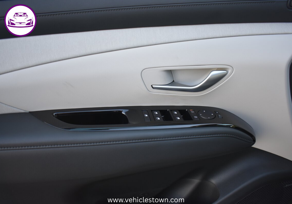 "Side view of the Hyundai Tucson Hybrid SUV in motion, showcasing its sleek design and eco-friendly features"