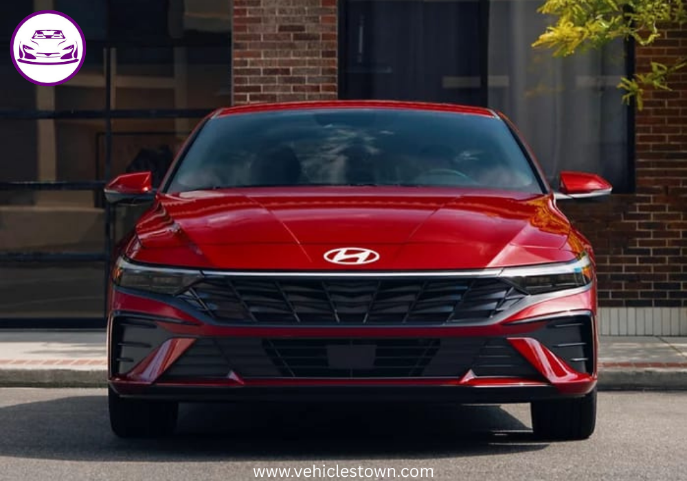 "Front view of the 2025 Hyundai Elantra Hybrid showcasing its sleek parametric grille and LED headlights."