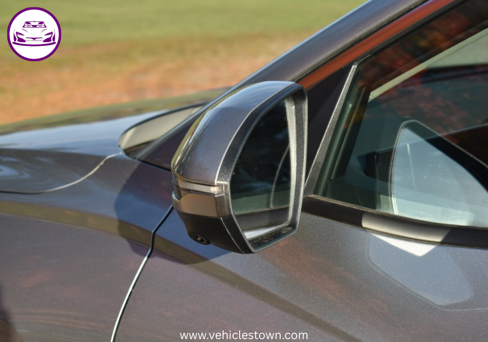 "Side view of the Hyundai Tucson Hybrid SUV in motion, showcasing its sleek design and eco-friendly features"