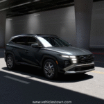 "Side view of the Hyundai Tucson Hybrid SUV in motion, showcasing its sleek design and eco-friendly features"