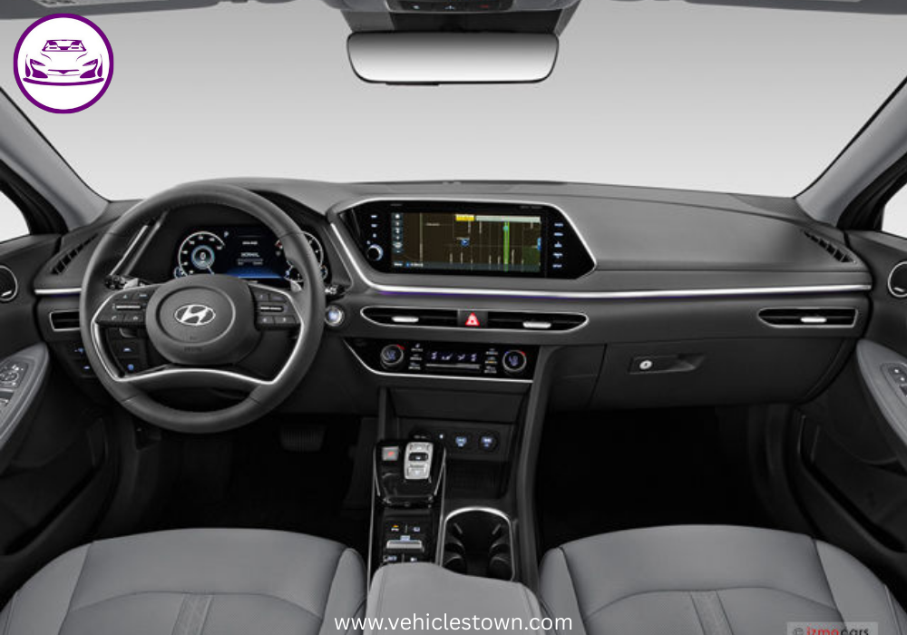 Side view of a sleek silver Hyundai Sonata parked under daylight. Modern midsize sedan showcasing bold design and aerodynamic curves.