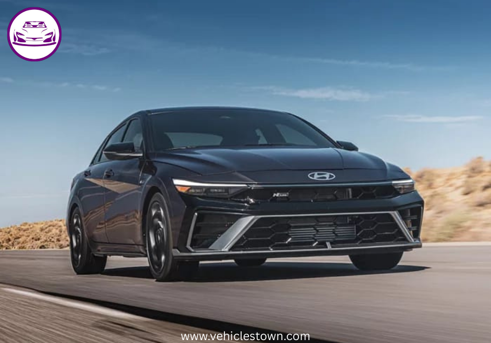 "Front view of the 2025 Hyundai Elantra Hybrid showcasing its sleek parametric grille and LED headlights."