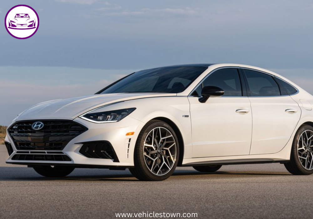 Side view of a sleek silver Hyundai Sonata parked under daylight. Modern midsize sedan showcasing bold design and aerodynamic curves.