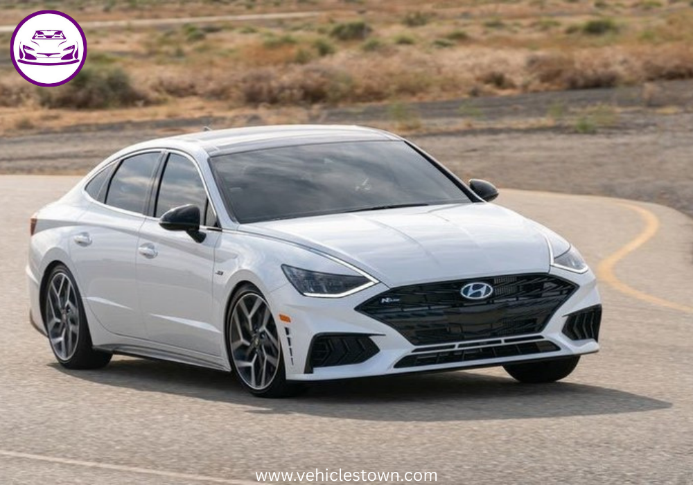 Side view of a sleek silver Hyundai Sonata parked under daylight. Modern midsize sedan showcasing bold design and aerodynamic curves.