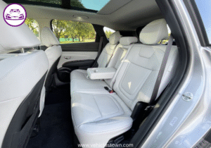 "Side view of the Hyundai Tucson Hybrid SUV in motion, showcasing its sleek design and eco-friendly features"