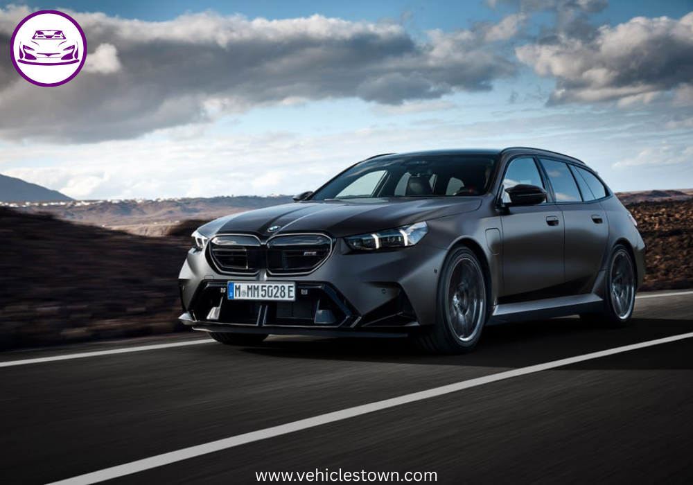 2025 BMW M5 Touring in motion, showcasing its sleek design, hybrid performance, and M xDrive system.