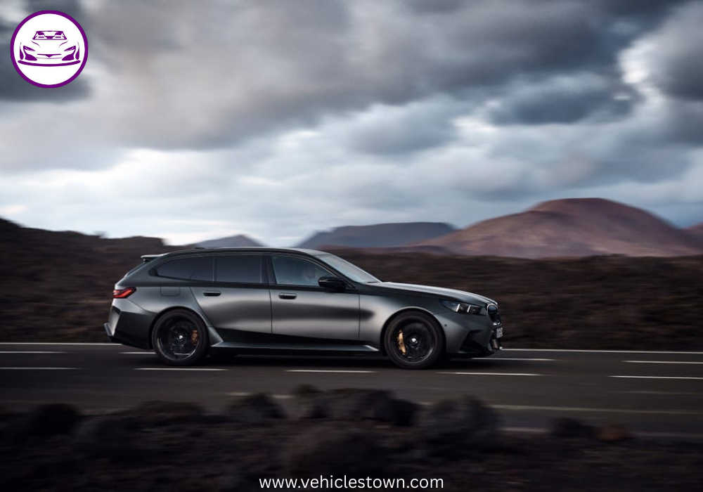 2025 BMW M5 Touring in motion, showcasing its sleek design, hybrid performance, and M xDrive system.