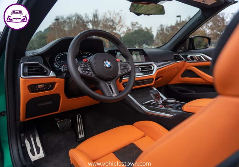 "BMW M4 Convertible xDrive in motion with sleek design and open-top driving, showcasing powerful performance and luxury."