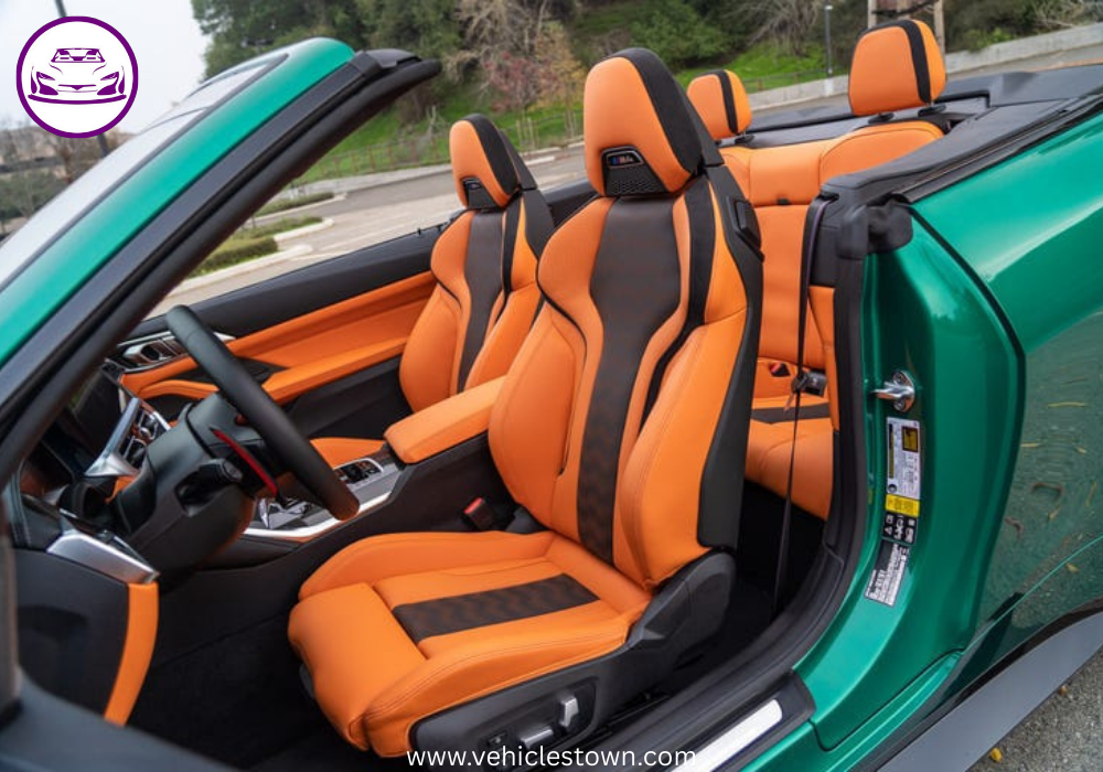 "BMW M4 Convertible xDrive in motion with sleek design and open-top driving, showcasing powerful performance and luxury."