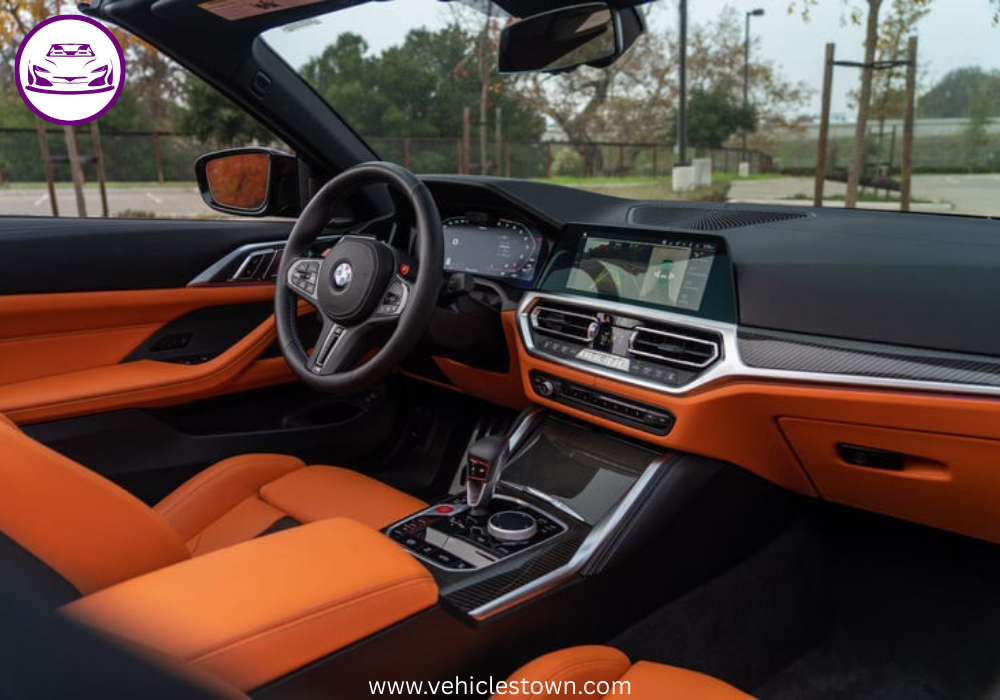 "BMW M4 Convertible xDrive in motion with sleek design and open-top driving, showcasing powerful performance and luxury."