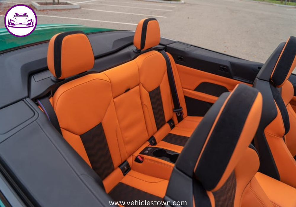 "BMW M4 Convertible xDrive in motion with sleek design and open-top driving, showcasing powerful performance and luxury."