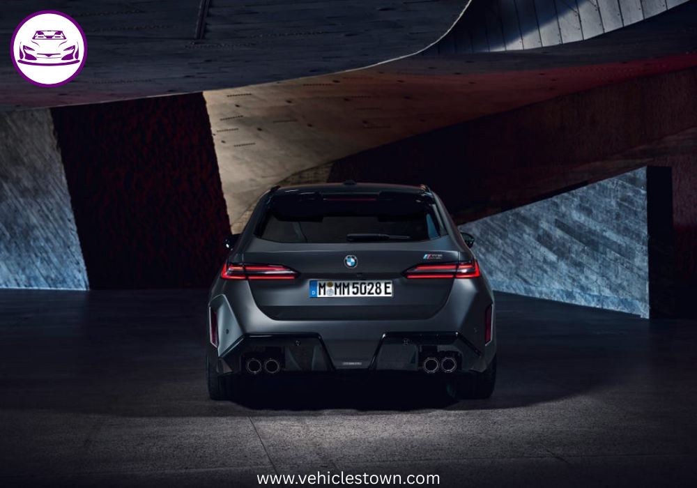 2025 BMW M5 Touring in motion, showcasing its sleek design, hybrid performance, and M xDrive system.