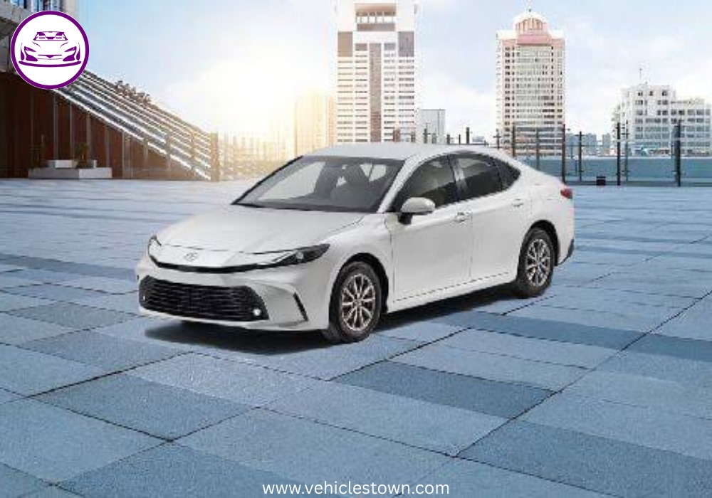 **Alt Text:**
Toyota Camry LE 2025 – elegant silver sedan with sleek LED headlights and stylish body lines, parked in a modern urban setting.