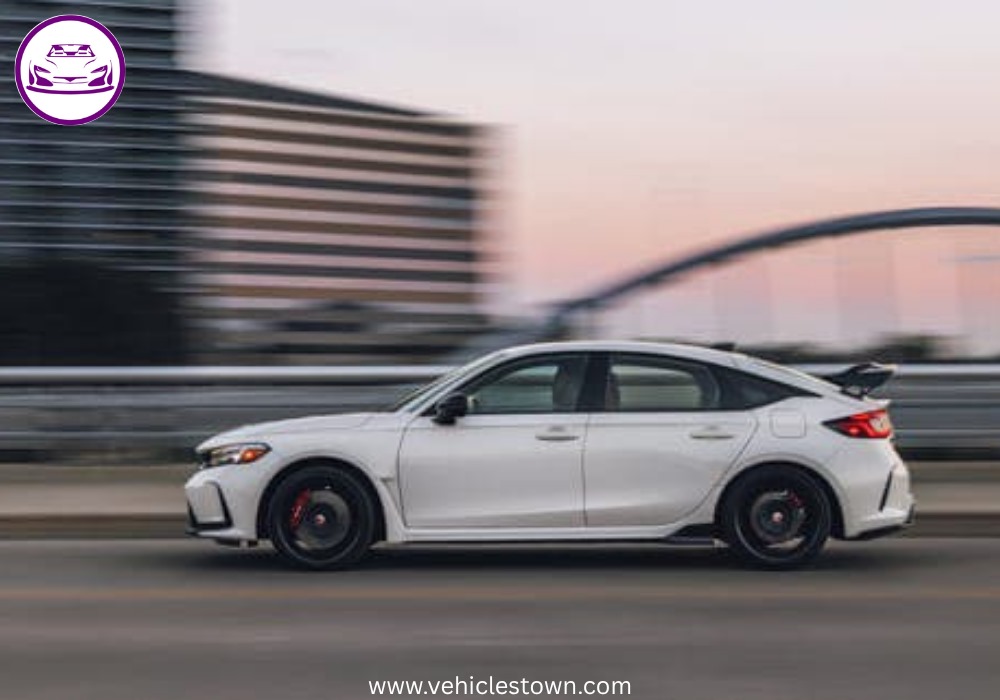 Front view of the bold and sporty red Honda Civic Type R showcasing its aggressive grille and large rear wing.