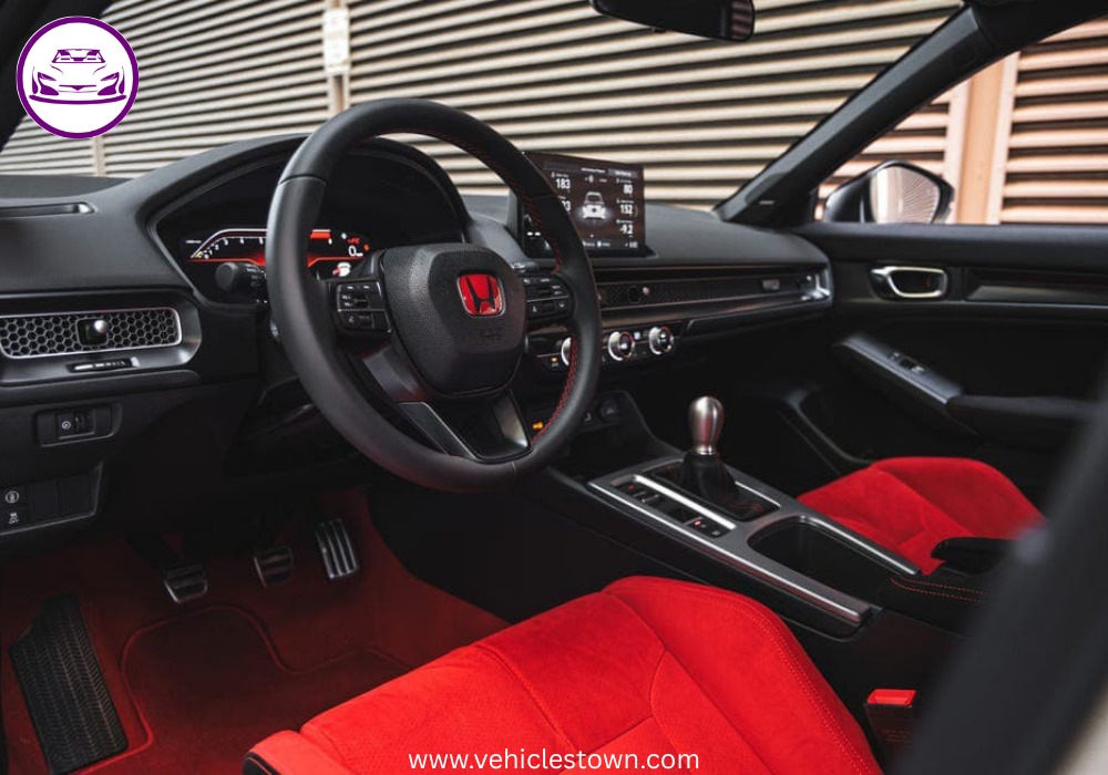 Front view of the bold and sporty red Honda Civic Type R showcasing its aggressive grille and large rear wing.
