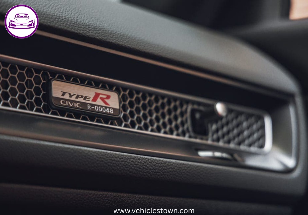 Front view of the bold and sporty red Honda Civic Type R showcasing its aggressive grille and large rear wing.