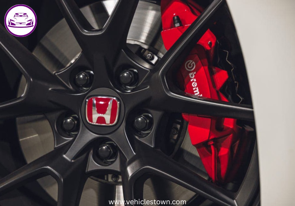 Front view of the bold and sporty red Honda Civic Type R showcasing its aggressive grille and large rear wing.