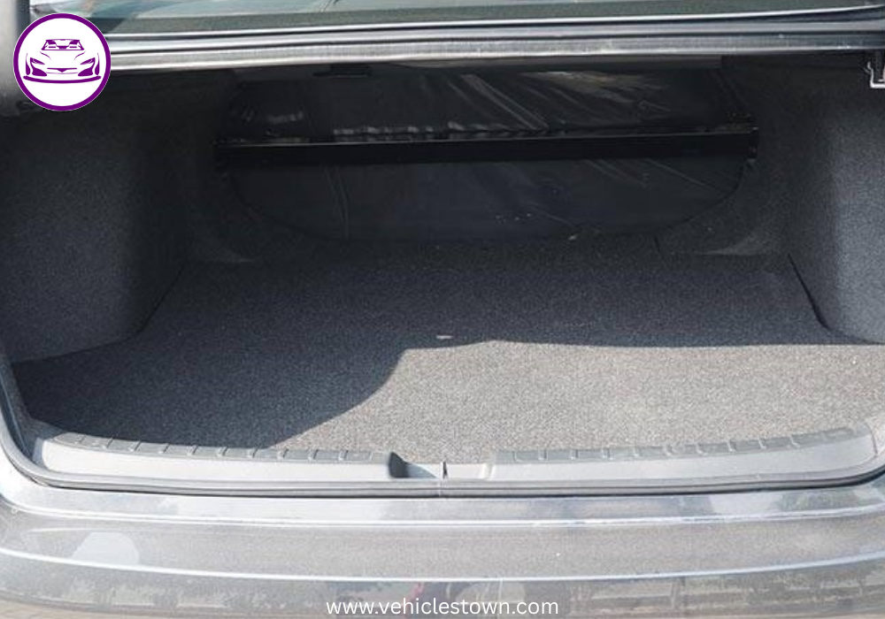 Honda Civic RS parked outdoors, showcasing sleek design and black alloy wheels.