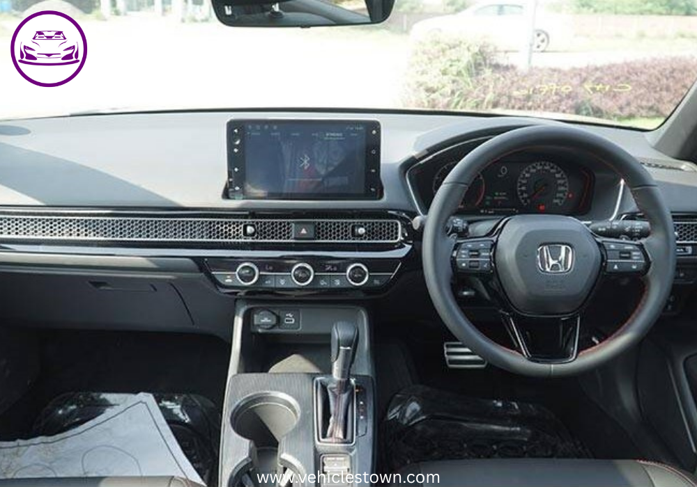 Honda Civic RS parked outdoors, showcasing sleek design and black alloy wheels.