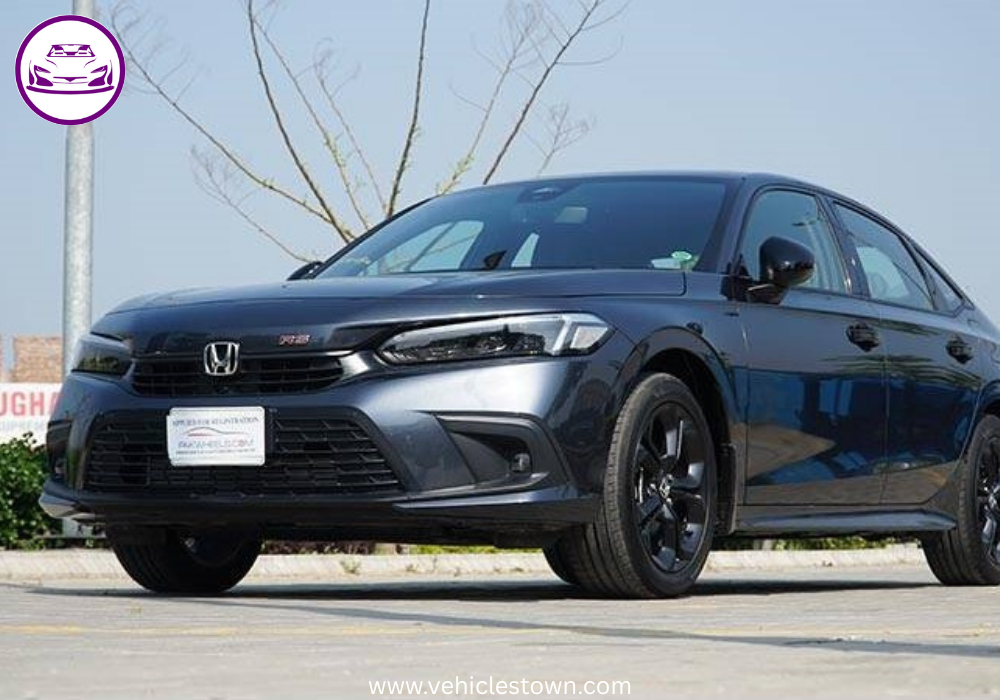 Honda Civic RS parked outdoors, showcasing sleek design and black alloy wheels.