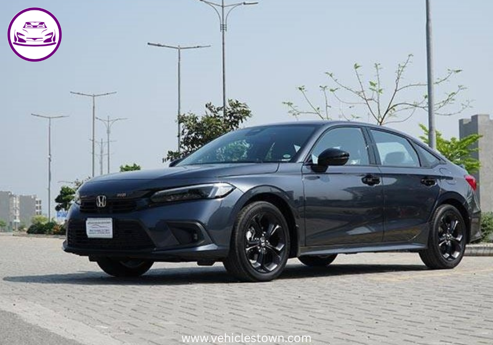 Honda Civic RS parked outdoors, showcasing sleek design and black alloy wheels.