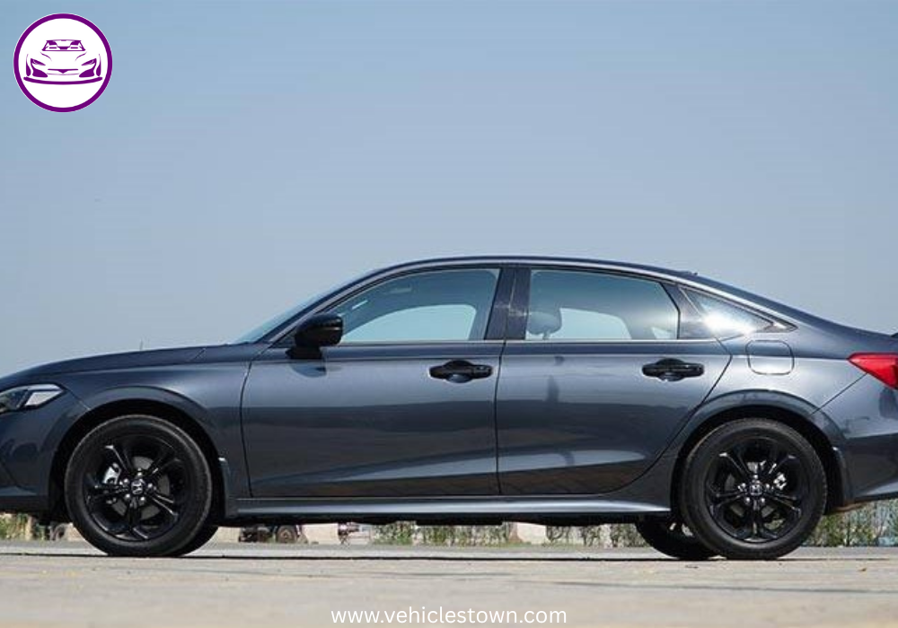 Honda Civic RS parked outdoors, showcasing sleek design and black alloy wheels.