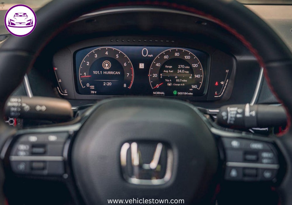 Honda Civic Si sporty red sedan parked, showcasing aggressive front grille and alloy wheels.