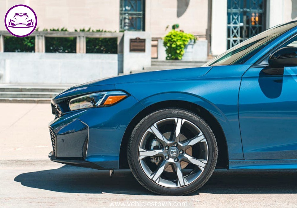 2025 Honda Civic Standard in silver, showcasing sleek design and modern LED headlights.