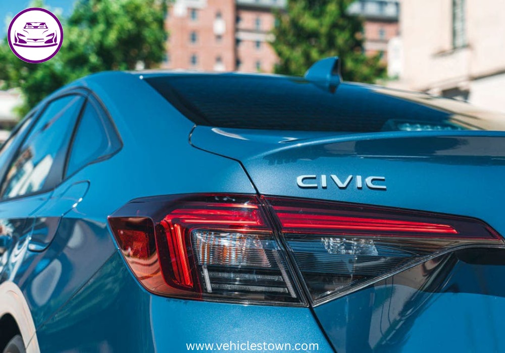 2025 Honda Civic Standard in silver, showcasing sleek design and modern LED headlights.