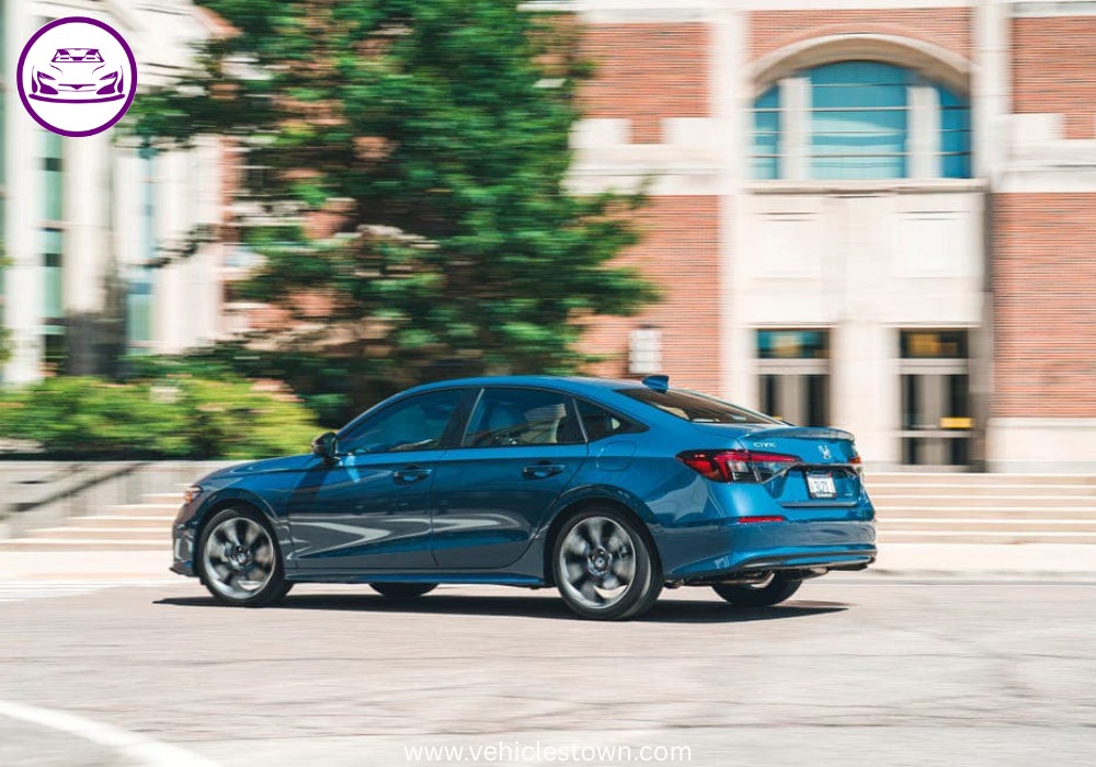 2025 Honda Civic Standard in silver, showcasing sleek design and modern LED headlights.