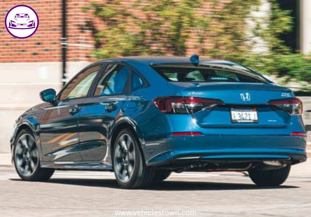 2025 Honda Civic Standard in silver, showcasing sleek design and modern LED headlights.