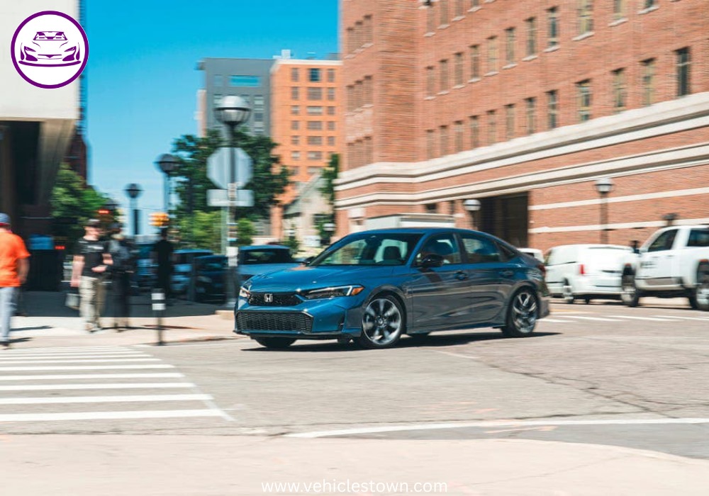 2025 Honda Civic Standard in silver, showcasing sleek design and modern LED headlights.
