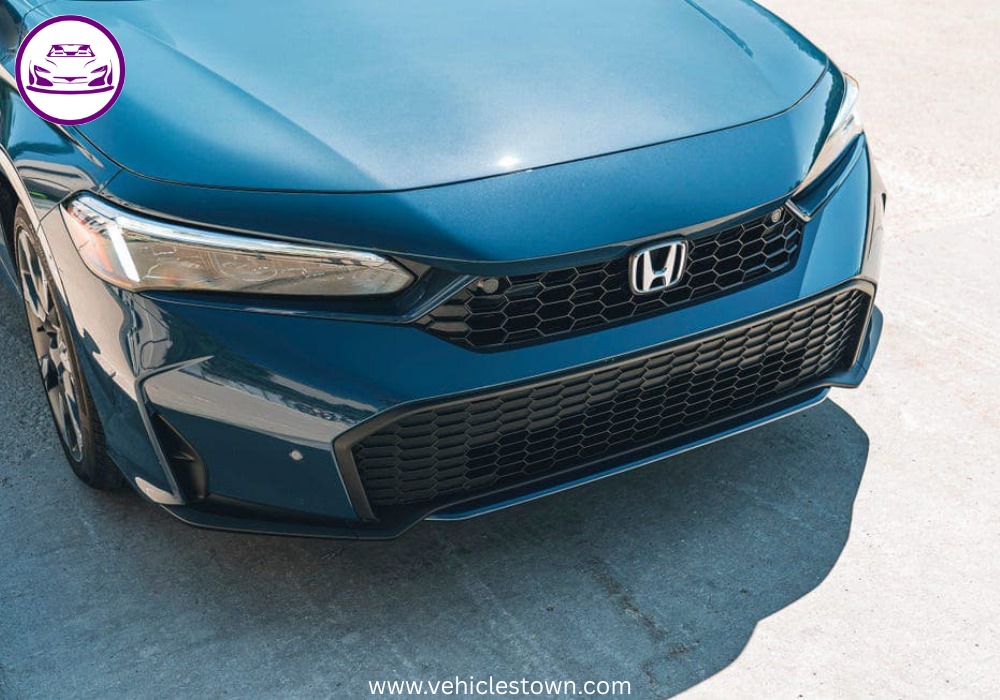 2025 Honda Civic Standard in silver, showcasing sleek design and modern LED headlights.