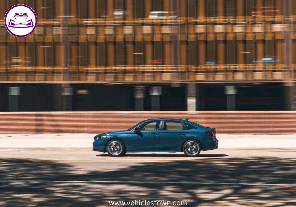 2025 Honda Civic Standard in silver, showcasing sleek design and modern LED headlights.