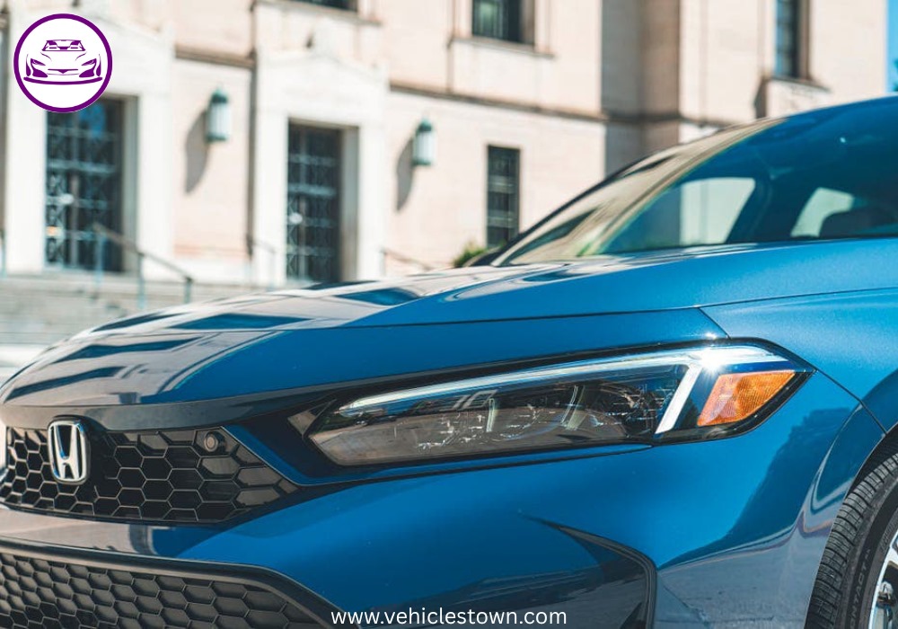2025 Honda Civic Standard in silver, showcasing sleek design and modern LED headlights.