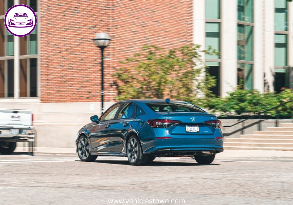 2025 Honda Civic Standard in silver, showcasing sleek design and modern LED headlights.