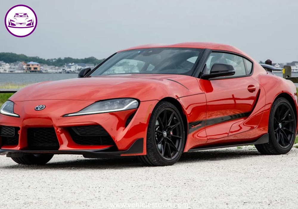 A sleek, red 2025 Toyota GR Supra 3.0 sits parked, highlighting its aggressive styling and ready-to-drive presence.