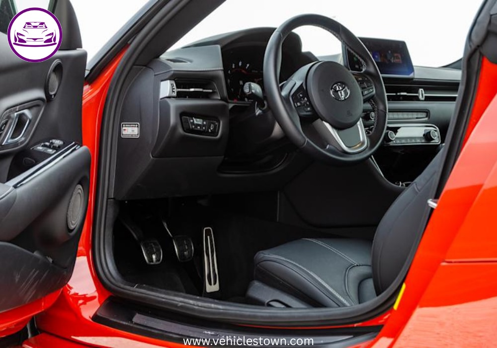 A sleek, red 2025 Toyota GR Supra 3.0 sits parked, highlighting its aggressive styling and ready-to-drive presence.