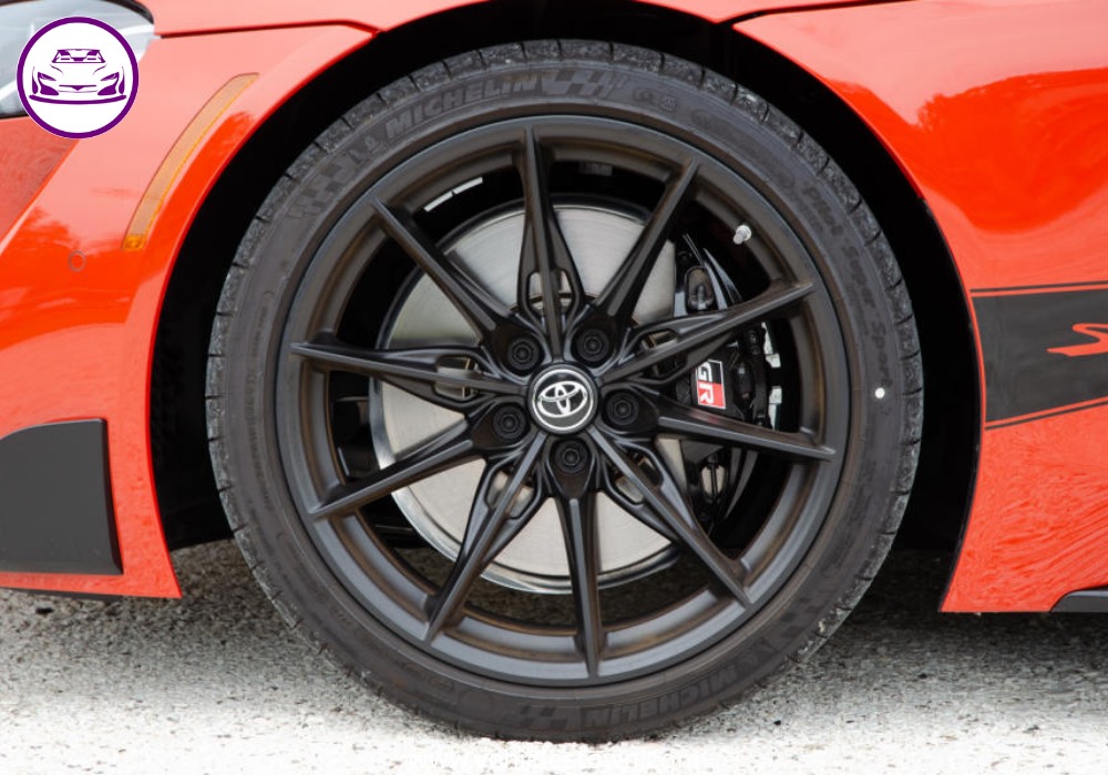 A sleek, red 2025 Toyota GR Supra 3.0 sits parked, highlighting its aggressive styling and ready-to-drive presence.