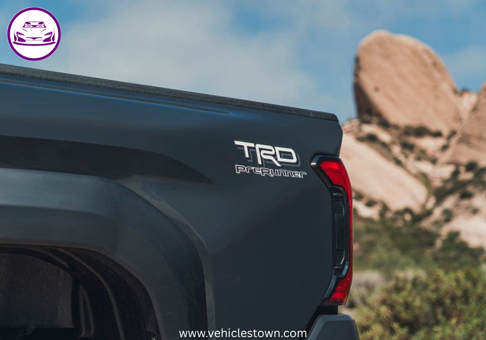 Side view of the 2025 Toyota Tacoma PreRunner showcasing its rugged design and high ground clearance.

