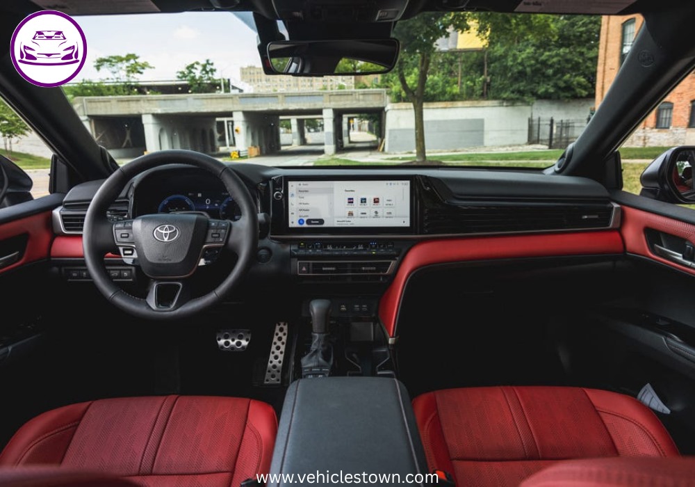 Toyota Camry XSE in a sporty stance featuring blacked-out grille, 19-inch alloy wheels, and aggressive LED headlights on a city street.