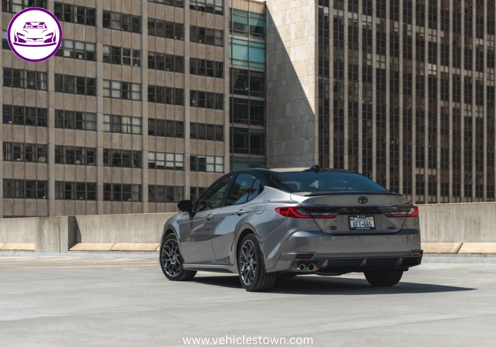 Toyota Camry XSE in a sporty stance featuring blacked-out grille, 19-inch alloy wheels, and aggressive LED headlights on a city street.