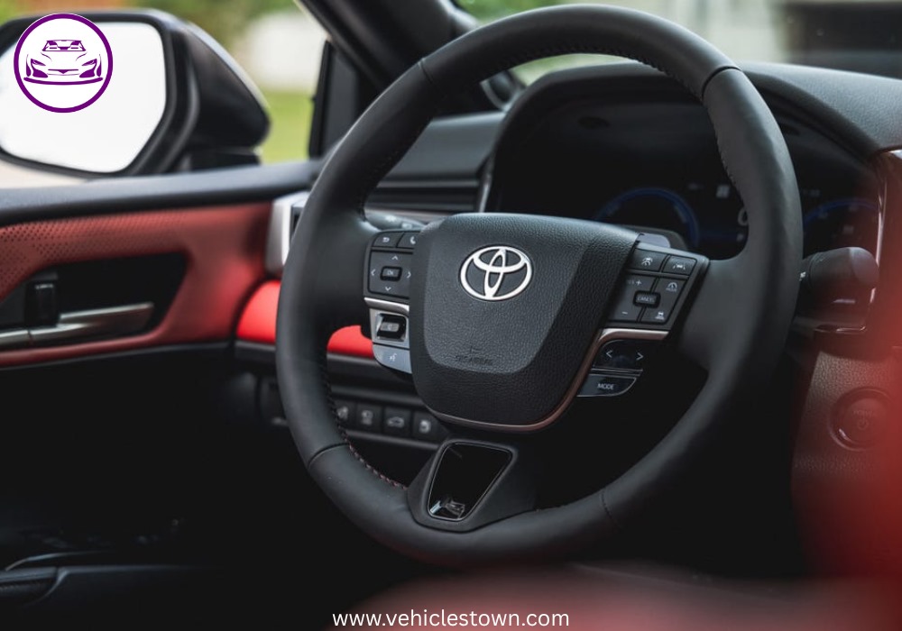 Toyota Camry XSE in a sporty stance featuring blacked-out grille, 19-inch alloy wheels, and aggressive LED headlights on a city street.