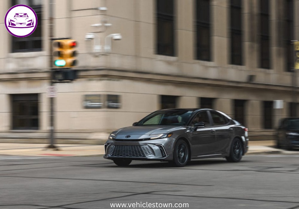 Toyota Camry XSE in a sporty stance featuring blacked-out grille, 19-inch alloy wheels, and aggressive LED headlights on a city street.