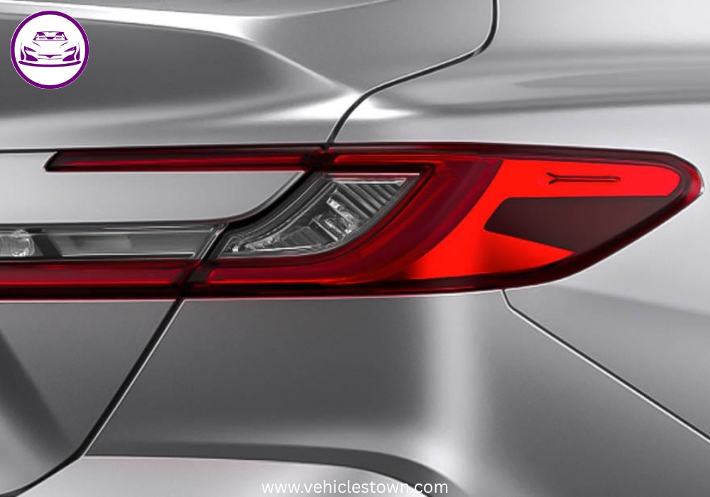 **Alt Text:**
Toyota Camry XLE front and side view showcasing its sleek design, LED headlights, and alloy wheels in a premium urban setting.