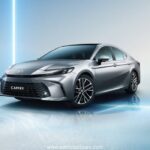 **Alt Text:** Toyota Camry XLE front and side view showcasing its sleek design, LED headlights, and alloy wheels in a premium urban setting.