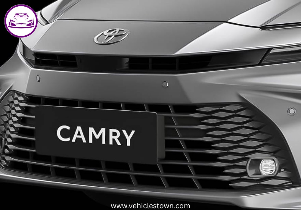 **Alt Text:**
Toyota Camry XLE front and side view showcasing its sleek design, LED headlights, and alloy wheels in a premium urban setting.